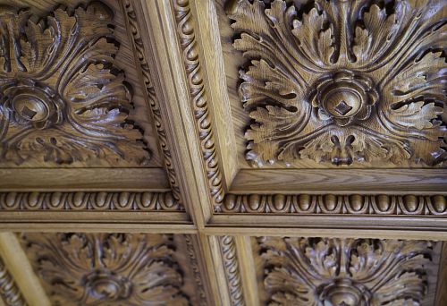 Carved ceiling panel made of oak with a classic leaf pattern