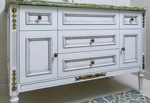 Elegant white bathroom vanity with carved elements