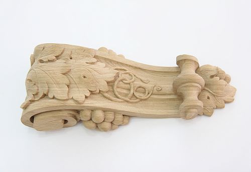 Hand-carved wooden element with plant ornament for interior decoration and creating coziness in the home