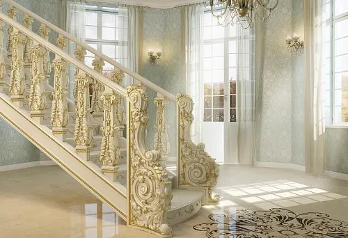 Luxurious Classic Staircase with Carved Balusters and Gold-Plated Elements Leading to the Second Floor of a Spacious Bright Hall.
