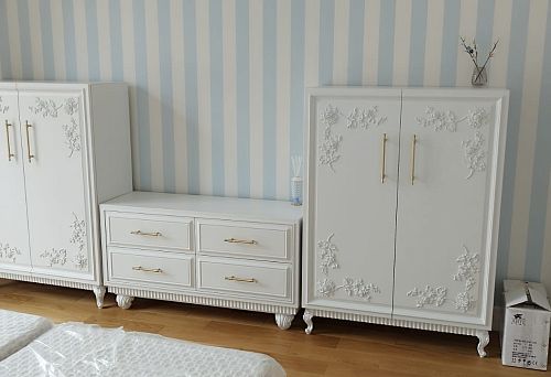 Elegant furniture set in classic style with decorative elements.