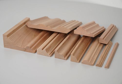 Set of wooden planks with different profiles from solid beech for decorative wall and ceiling finishing