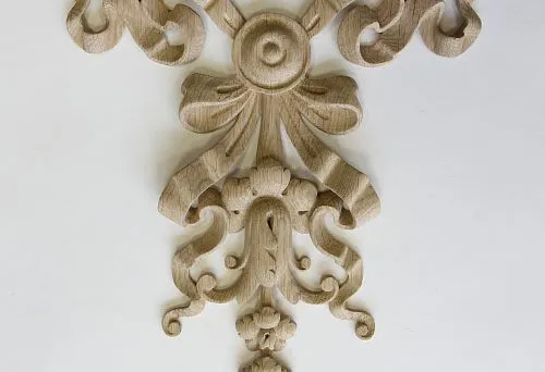 Carved Wooden Decorative Inlay with Elegant Bow and Scrolls for Interior Decoration.