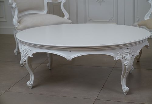 Designer furniture with carved elements and refined finish