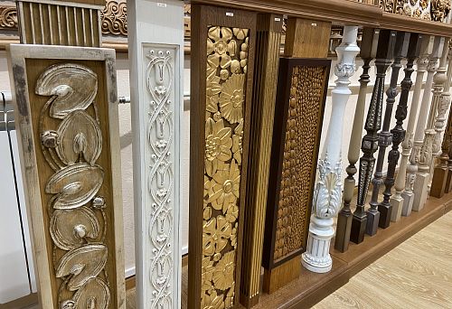 Photo of balustrades with various carved and decorative wooden elements