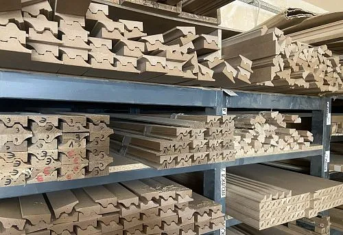 Shelf with various wooden profiles and finishing elements, folded for storage