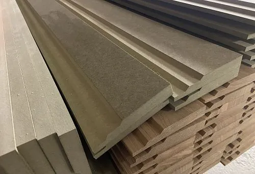 MDF baseboard sheets neatly stacked on top of each other