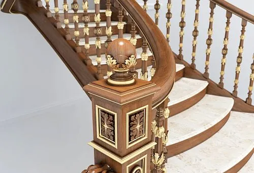 Wooden initial stair post with carving and decorative elements