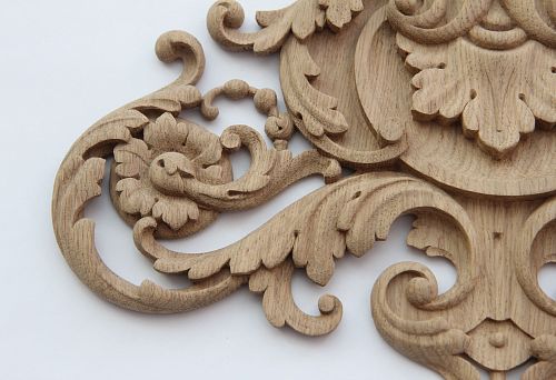 Carved wooden decorative element with elegant scrolls and floral motifs for a modern home