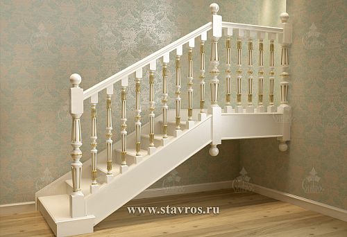 White newels with golden inlays, attached to the staircase steps