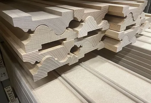 Decorative interior profile made of solid wood for stylish room finishing.