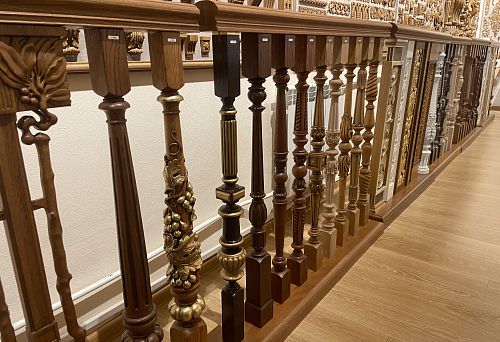 A row of exclusive carved and turned balusters made of oak and other wood species