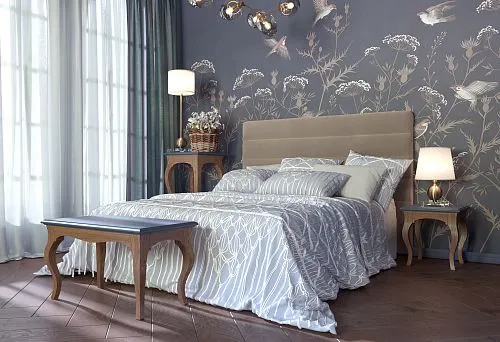 Double bed made of solid wood in an elegant bedroom with floral decor