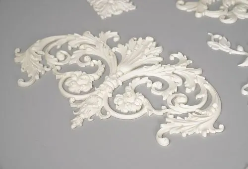Elegant molded decoration for a mood board interior.
