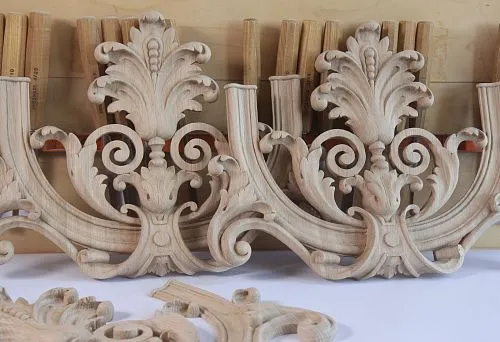 Carved wooden elements with classical ornament