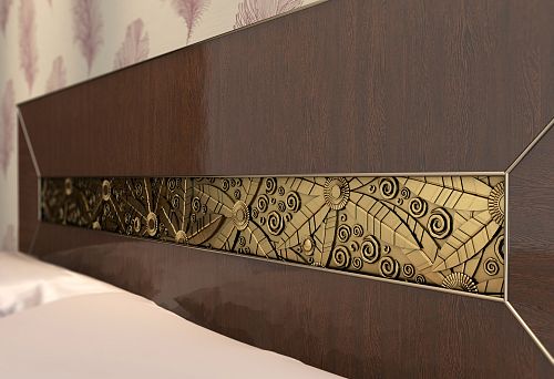Wooden headboard with decorative carving and geometric and floral ornament insert