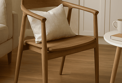 Modern wooden chair with soft cushion, placed in a bright interior