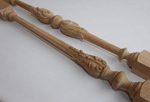Two carved wooden balusters from light solid wood