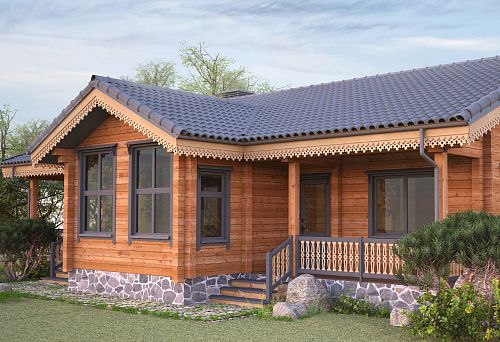 Wooden country house in Russian style with carved door casings and stone foundation