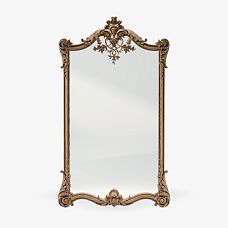 Mirror in carved wooden frame photo