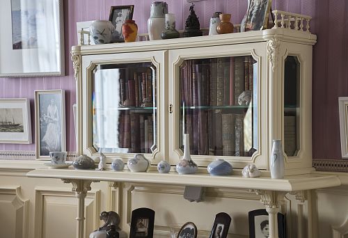 Luxurious Bookcase with Gilded Elements and Stained Glass Inserts