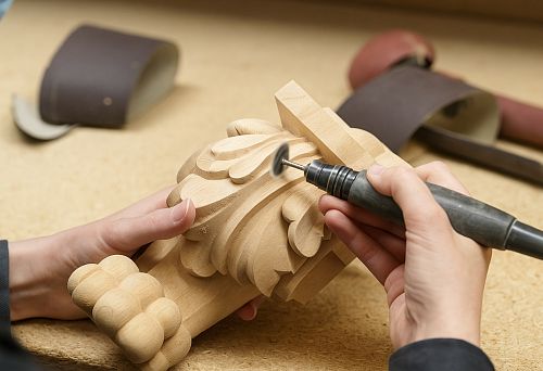 Wood carving in furniture element manufacturing &mdash; decorative part sanding process