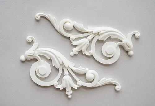 Decorative polyurethane elements in the form of elegant scrolls with botanical motifs