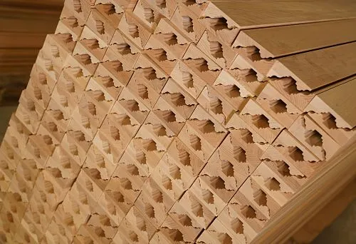 Stack of wooden decorative profiles with carved elements