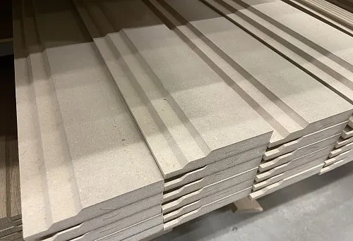 MDF skirting board blanks for painting, neatly stacked on top of each other