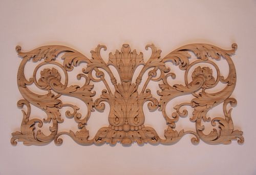 Wooden overlay decoration with symmetrical ornament