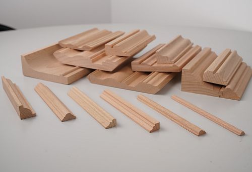 Wooden planks 40 mm and decorative elements from beech solid wood with different profiles for wall and ceiling finishing