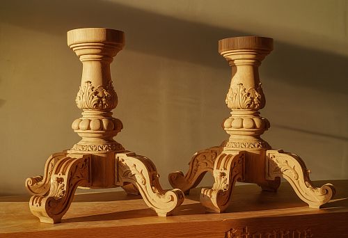 Two exclusive wooden pedestals with artistic carving on massive curved legs