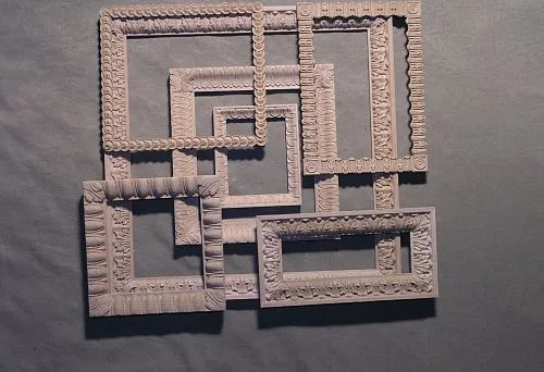 Decorative wooden frames with various carved ornamentation
