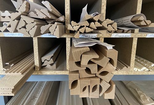 Set of Wooden Baseboards and Molding, Organized in Storage Compartments