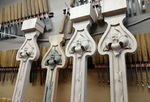 Decorative wooden elements with floral patterns &mdash; elegant interior decor items.