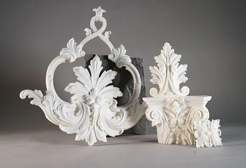 Polyurethane decorative facade elements, including a vegetal ornament capital and intricate molded decoration
