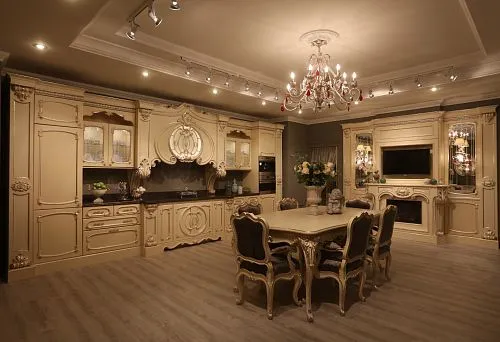 Carved dining table made of natural wood with decorative finish.