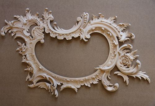 Carved wooden frame for mirror with floral ornament