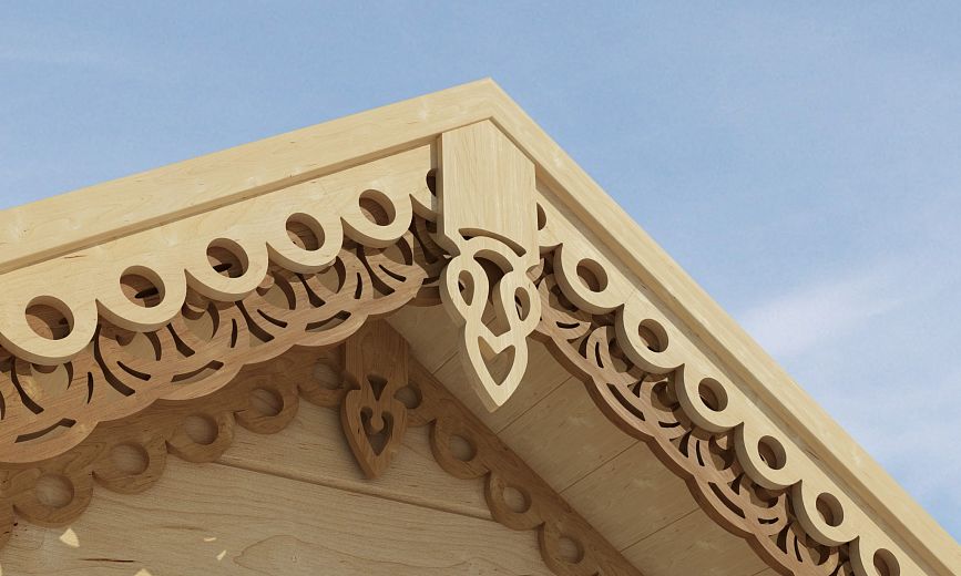 Close-up of a carved cornice with decorative round holes and elegant patterns
