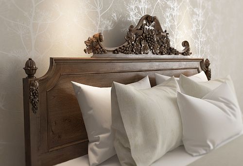 Bed made of natural wood with carved headboard for stylish bedroom