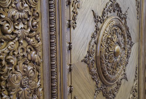 Decorative oak panel with relief carved ornament and central round rosette
