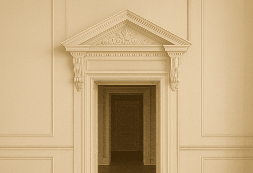 White carved pediment with decorative ornamentation