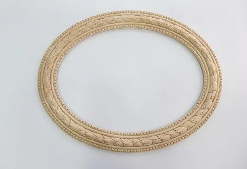 Oval carved frame made of natural wood with a classic pattern