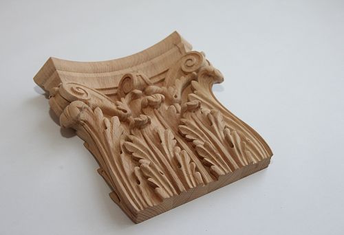 Carved wooden decor with delicate lines and elegant floral motifs.