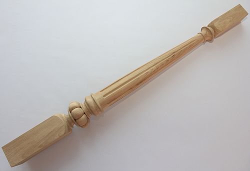 Single carved baluster made of natural wood with decorative elements