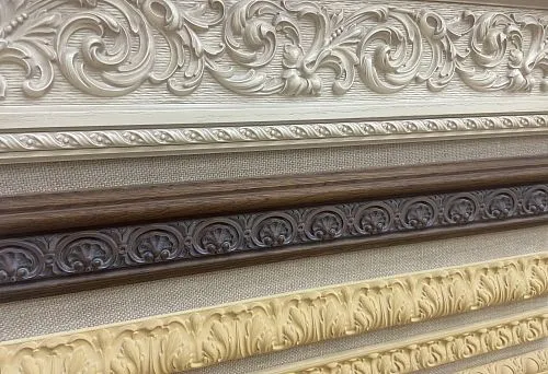 Set of carved wooden barge in various colors and textures, presented at the stand