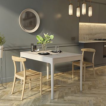 Front view of table Norton 002-009, showcasing its modern shape and natural wood finish.