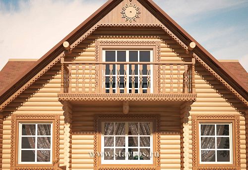 Wooden house with a carved gable and decorative balcony