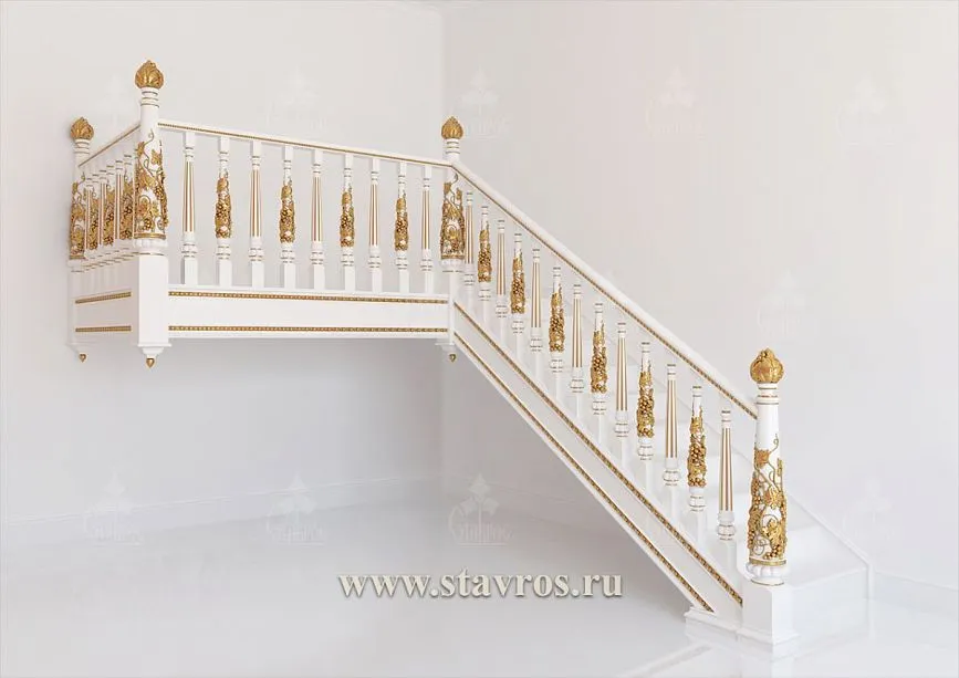 Classic staircase in solid wood with carved handrails and columns